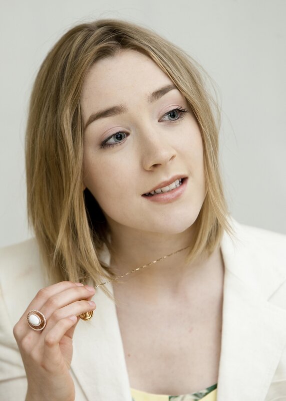 woman holding necklace