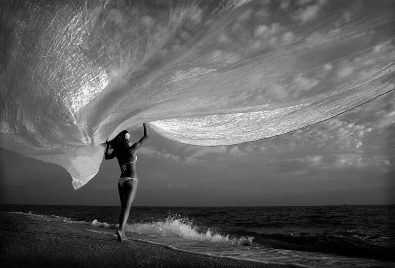 Woman Holding Net on Beach