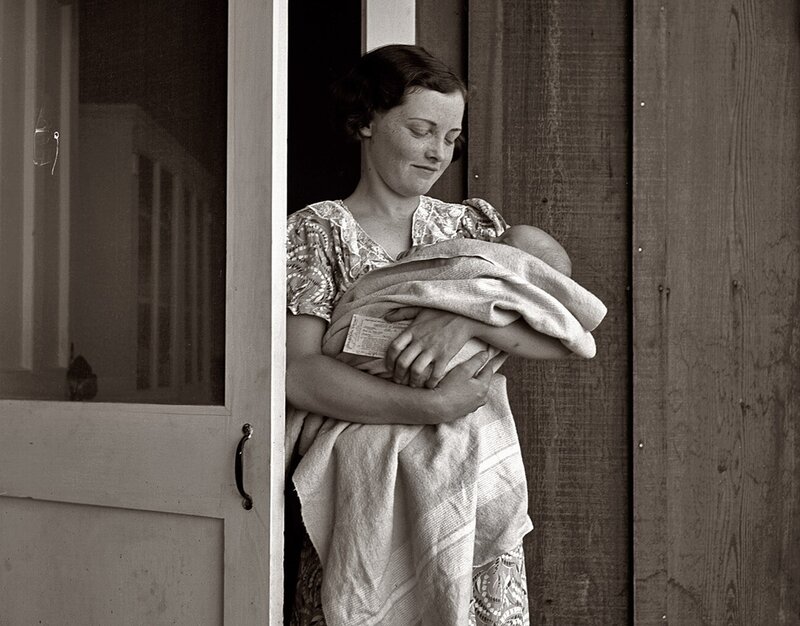 woman holding newborn baby