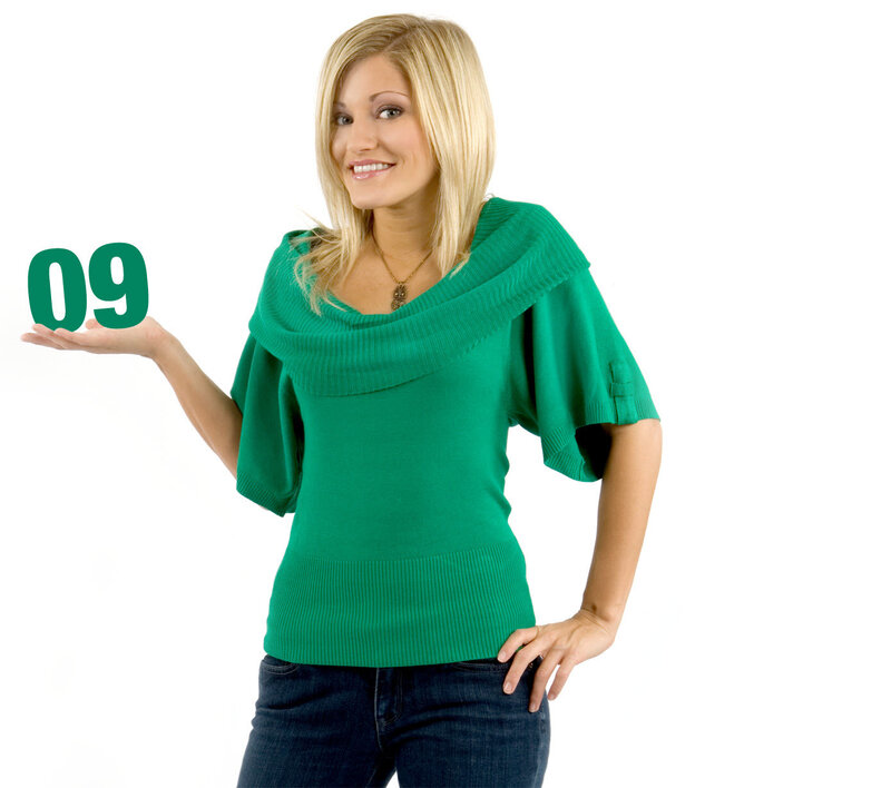 woman holding number nine