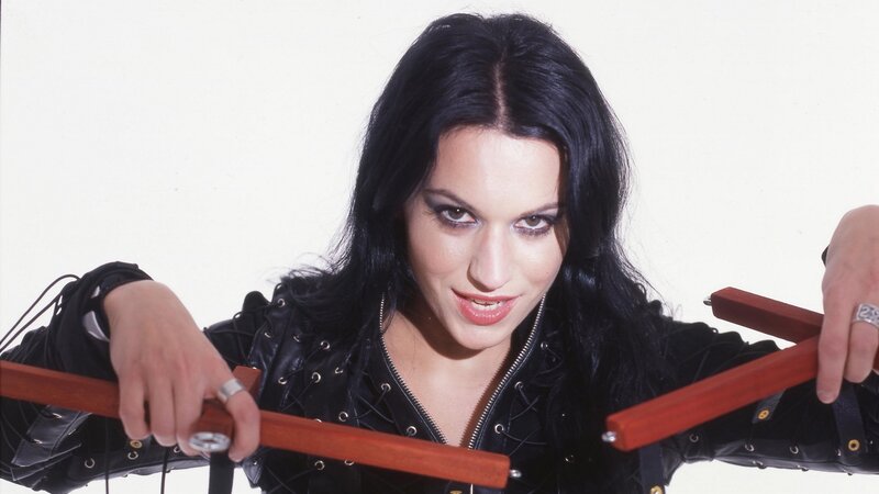 woman holding nunchucks