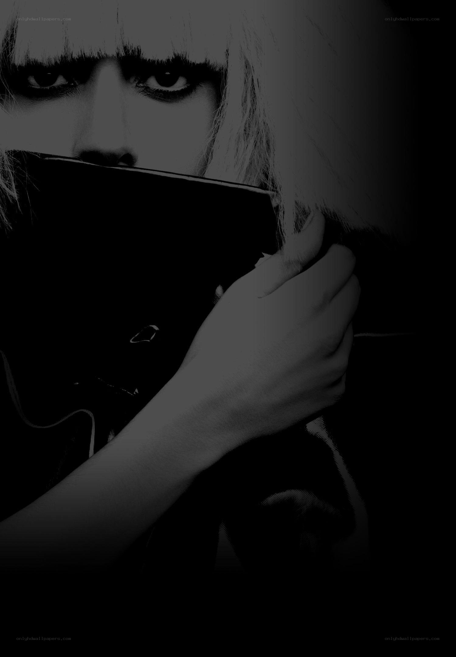woman holding object to face