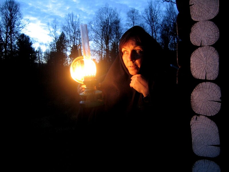 Woman Holding Oil Lamp — Black, Dramatic, Night, Photograph