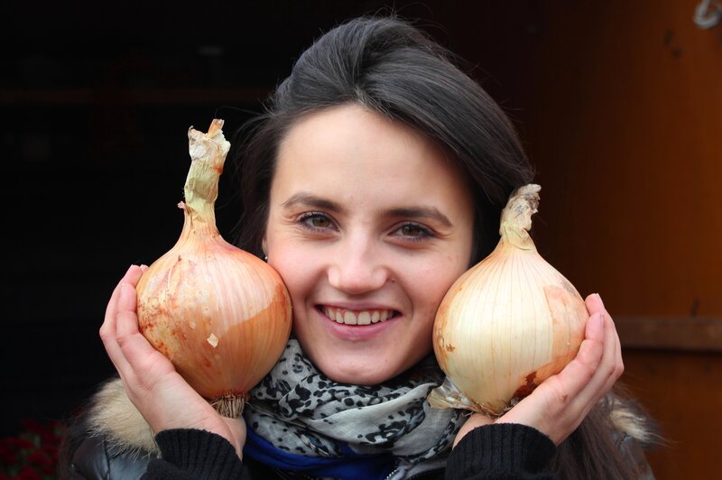 Woman Holding Onions