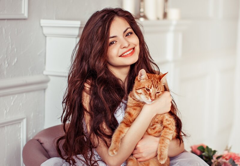 Woman Holding Orange Cat — White