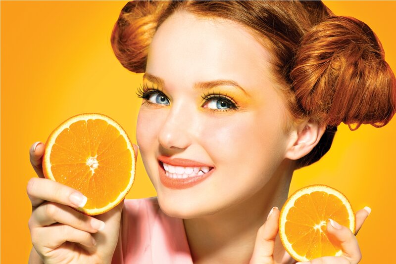 Woman Holding Oranges — Orange
