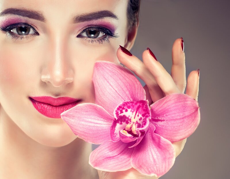 Woman Holding Orchid — Pink, Serene