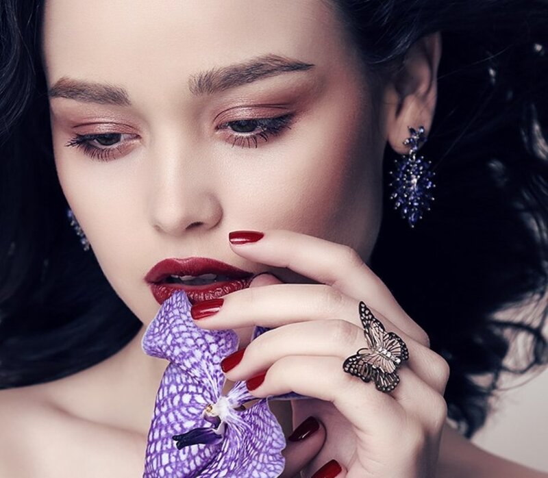 Woman Holding Orchid — Purple