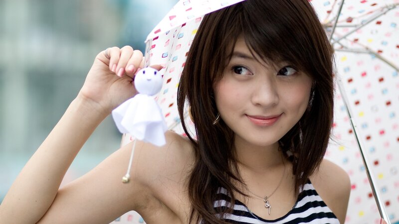woman holding origami doll