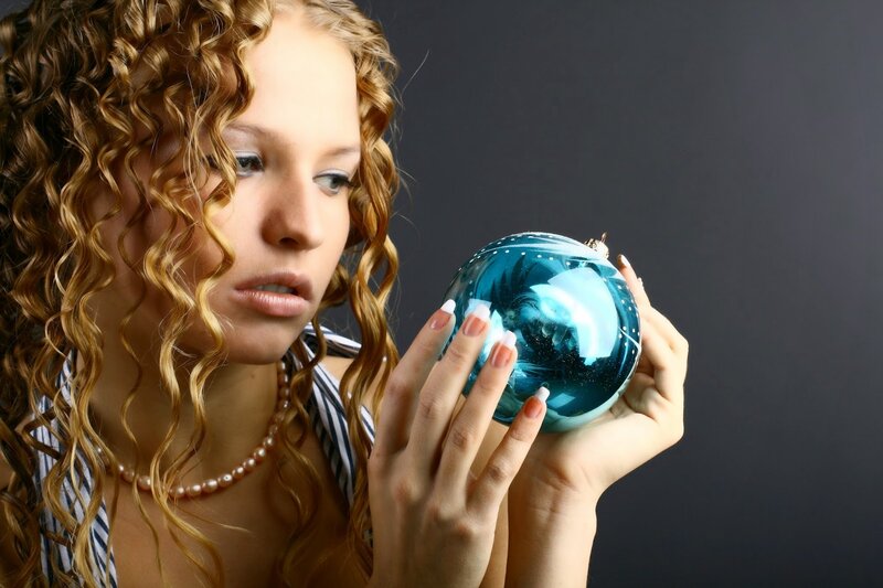 Woman Holding Ornament — Blue, Dramatic