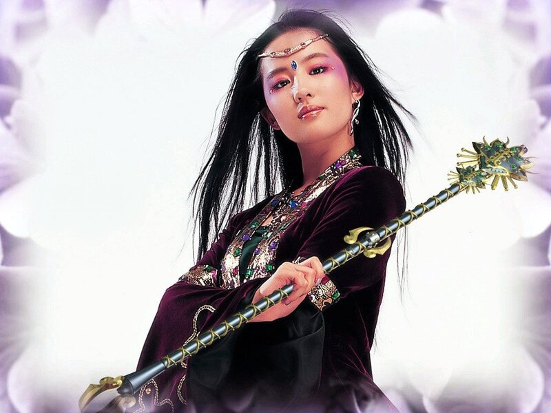 woman holding ornate staff