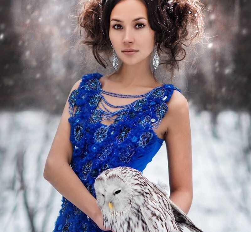 Woman Holding Owl — Blue