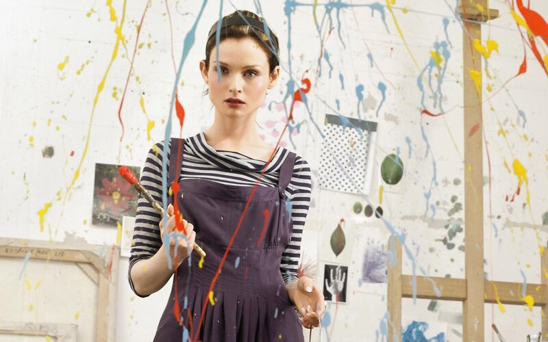 Woman Holding Paintbrush — Purple
