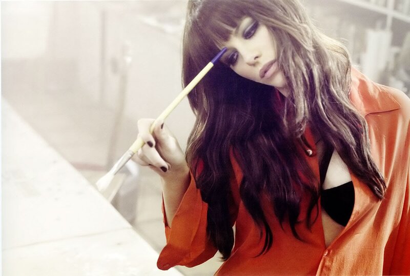 woman holding paintbrush