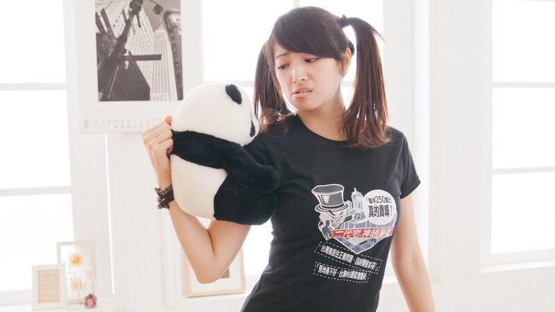 Woman holding panda plush