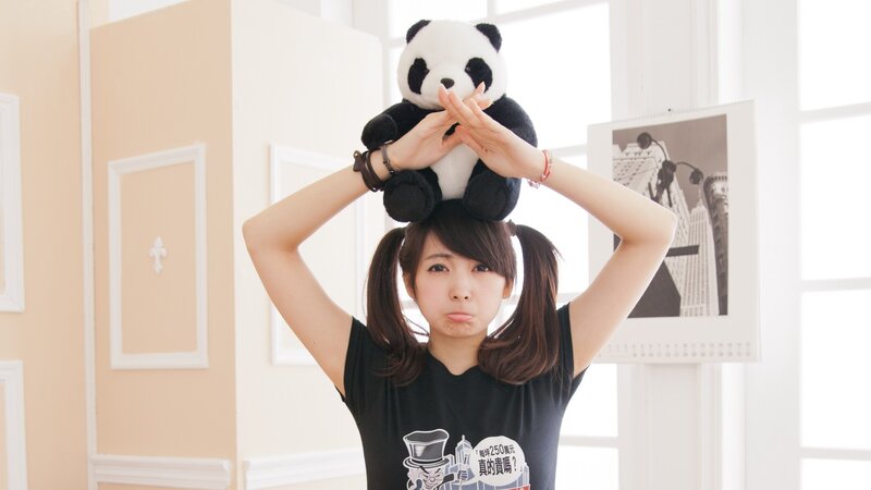 Woman holding panda plush