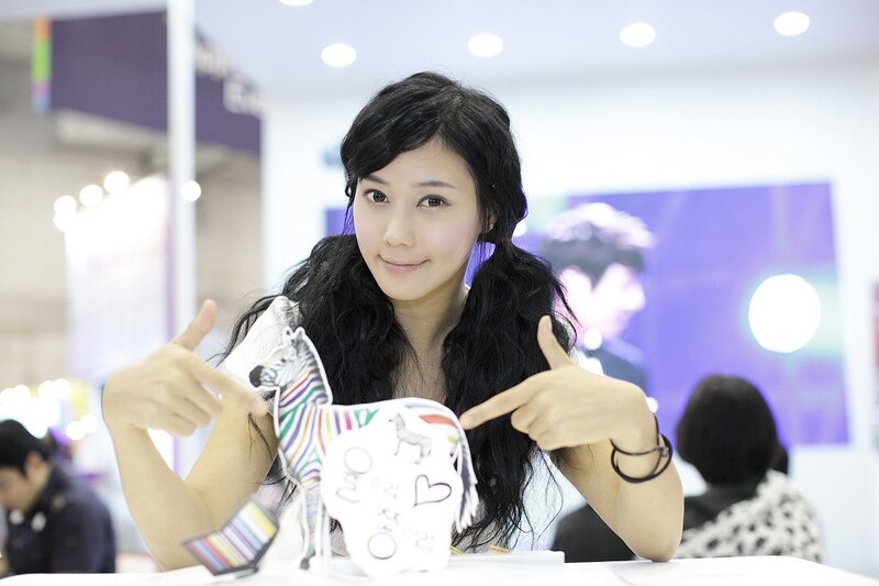woman holding paper craft