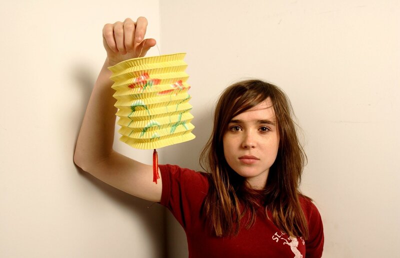 Woman Holding Paper Lantern — Yellow