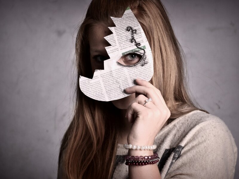 Woman Holding Paper Mask