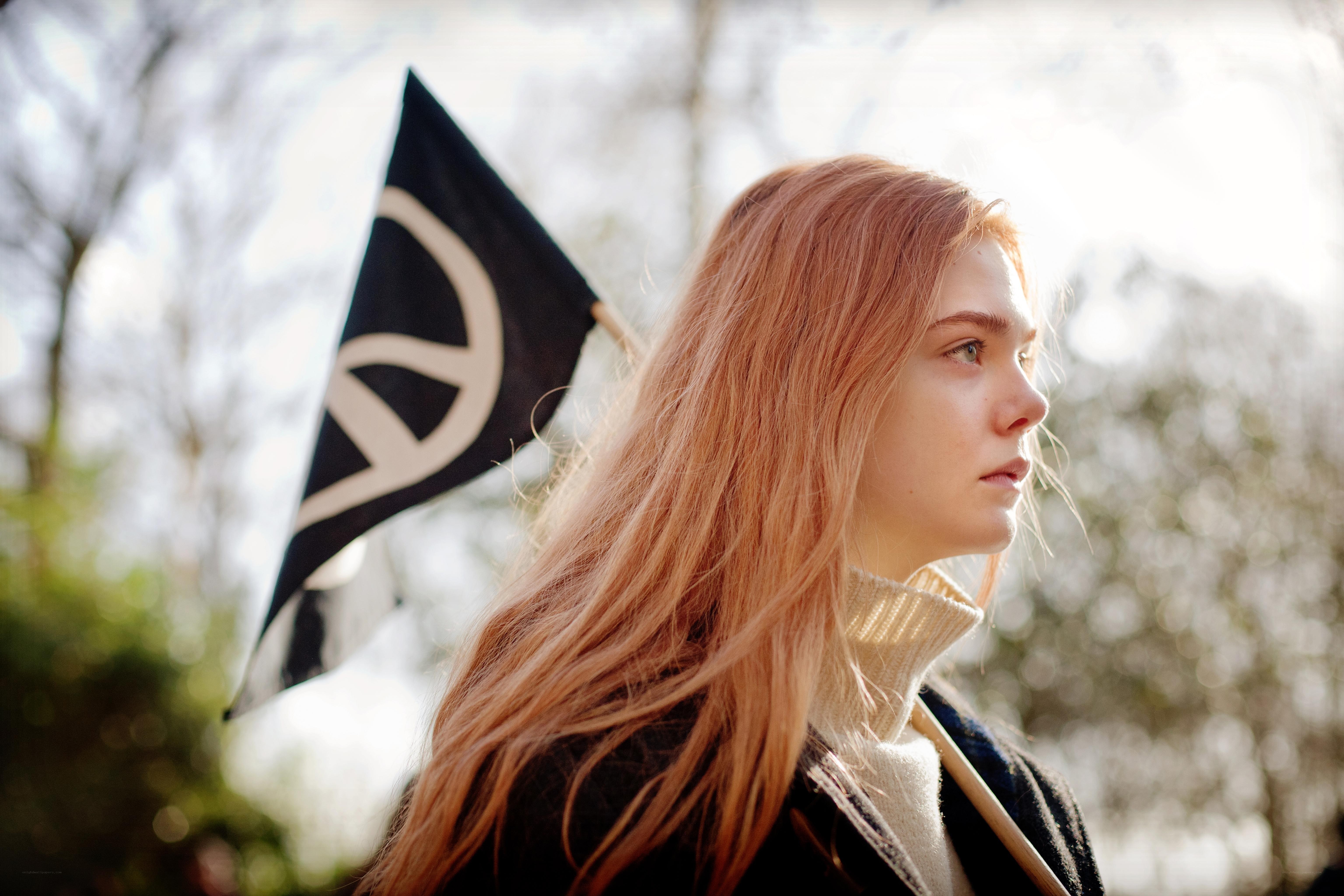woman holding peace flag