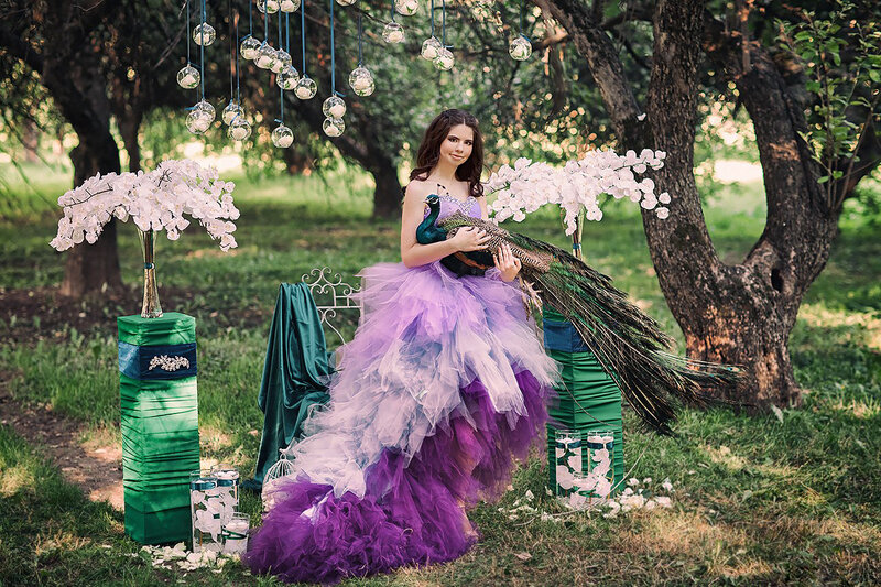 Woman Holding Peacock