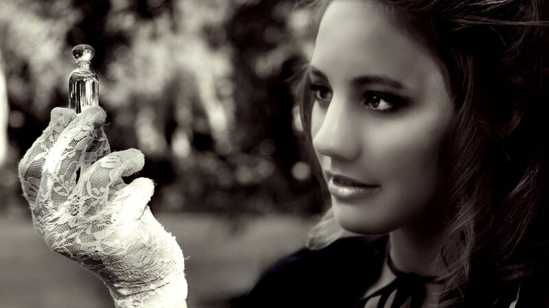 woman holding perfume bottle