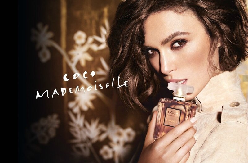 Woman Holding Perfume Bottle — Brown, Dramatic, Photograph