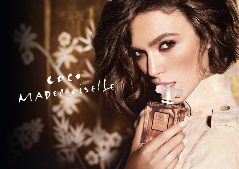 Woman Holding Perfume Bottle — Brown, Dramatic