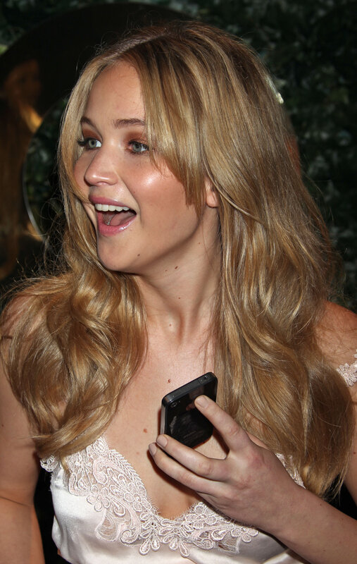 woman holding phone smiling
