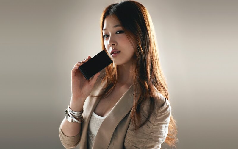 woman holding phone to ear