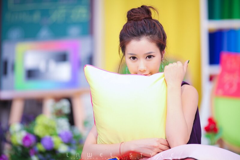 woman holding pillow in studio