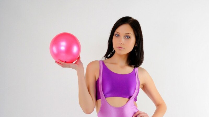woman holding pink ball