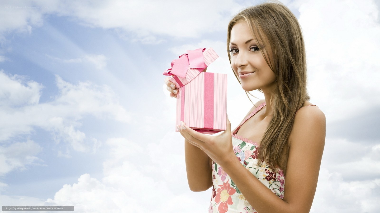 Woman holding pink gift box