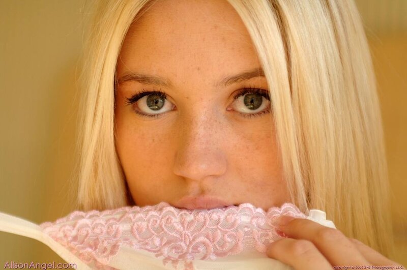 woman holding pink lace