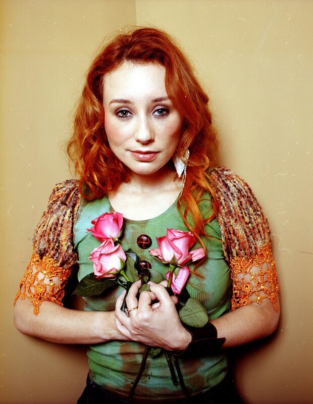 Woman holding pink roses