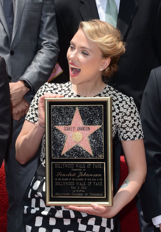 Woman Holding Plaque