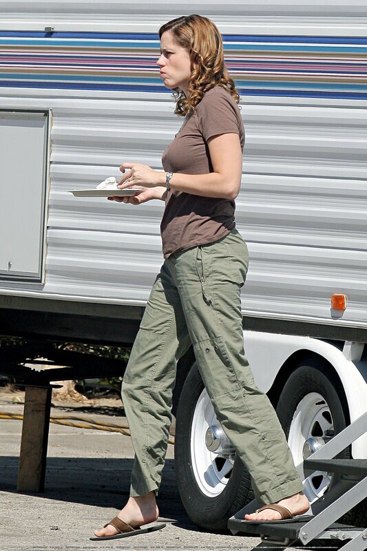 woman holding plate near trailer