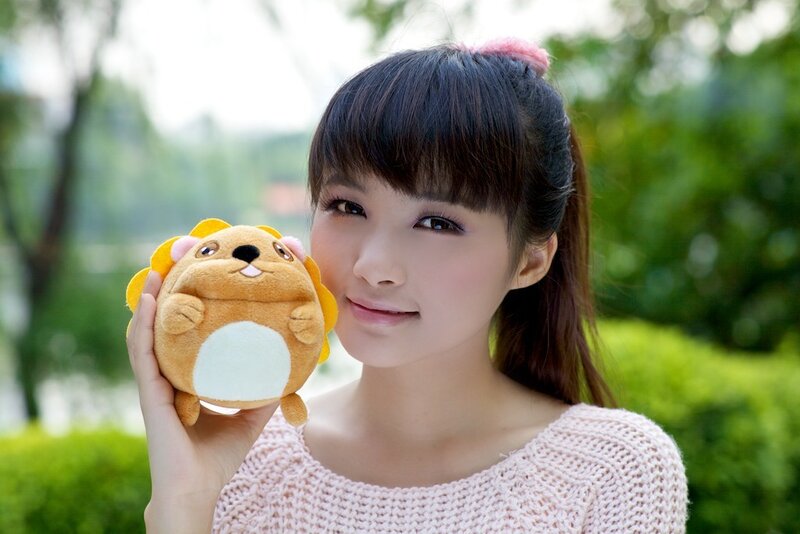 Woman holding plush toy