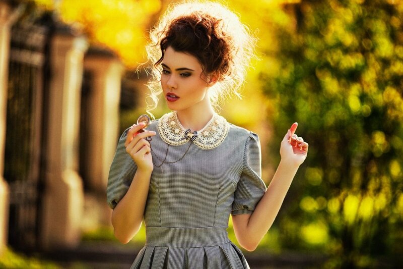 Woman Holding Pocket Watch — Yellow