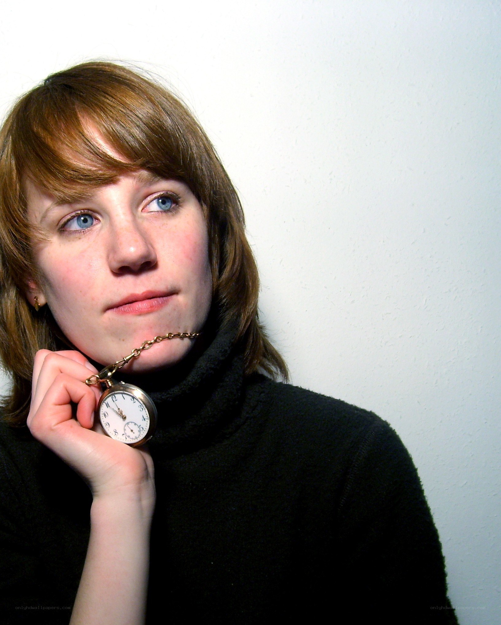 woman holding pocket watch