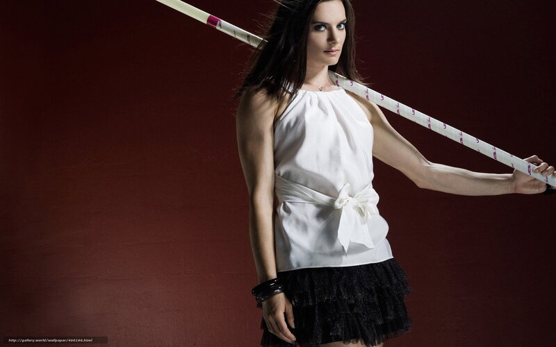 woman holding pole in studio