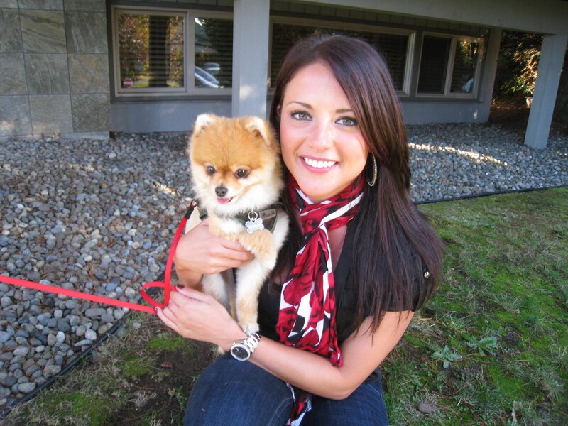 Woman Holding Pomeranian Dog