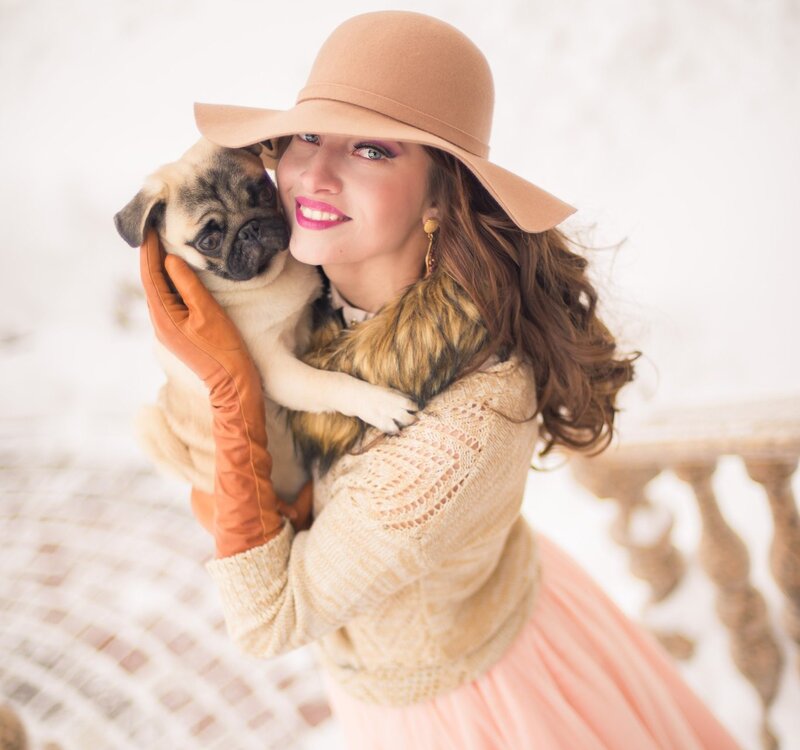 Woman Holding Pug Puppy