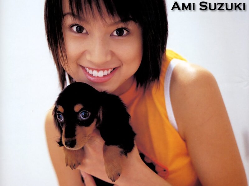 Woman Holding Puppy — Yellow