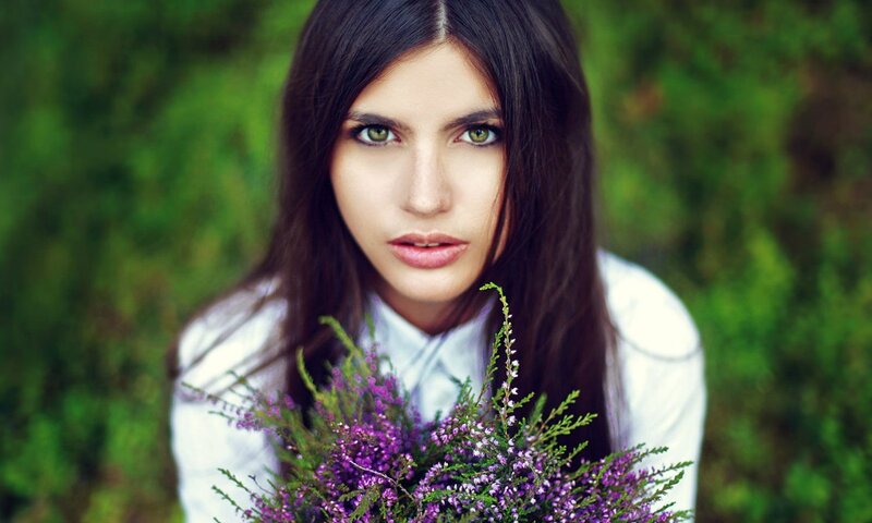 Woman Holding Purple Flowers — Calm