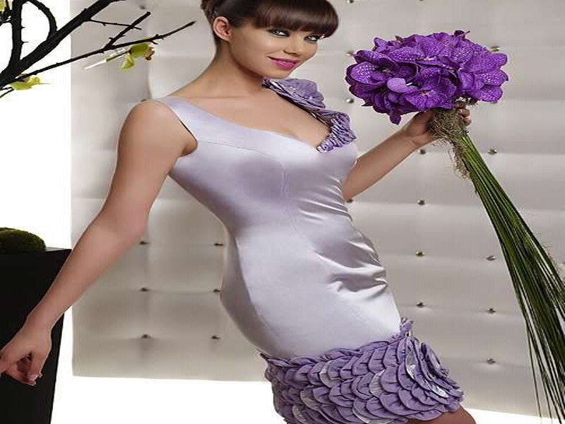 Woman Holding Purple Flowers — Elegant
