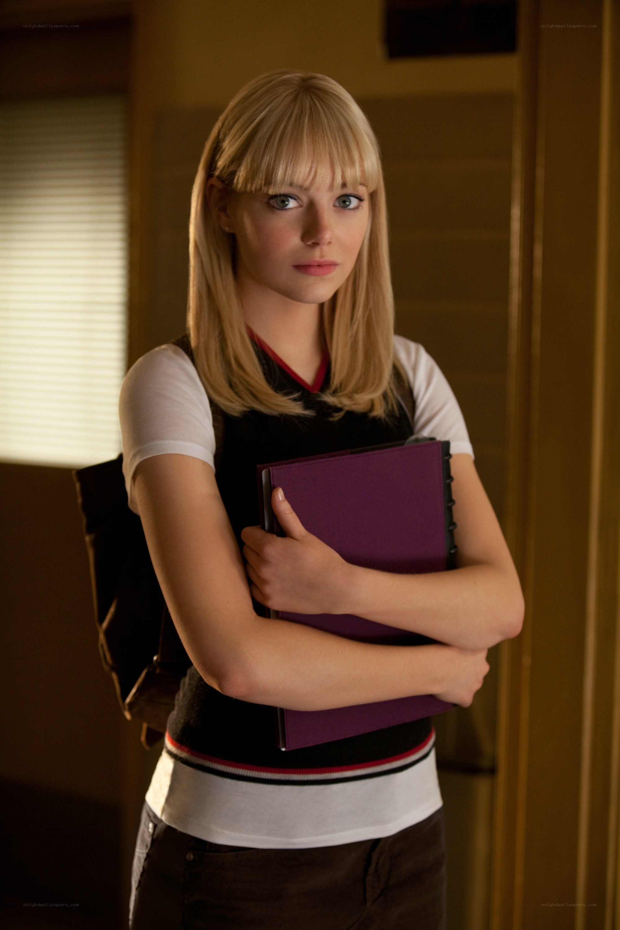 woman holding purple folder