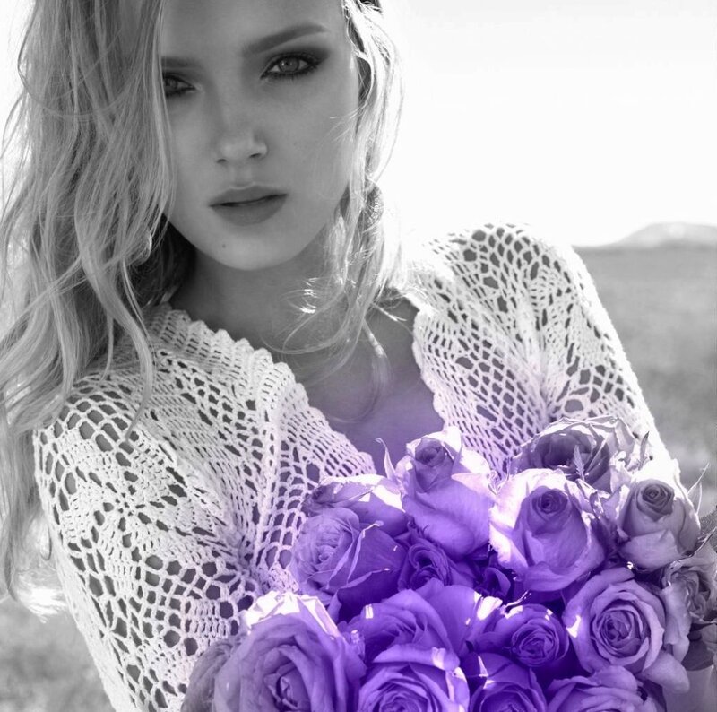 Woman Holding Purple Roses — Dramatic