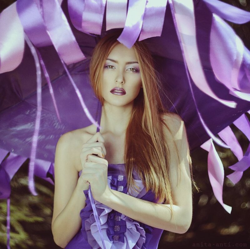 Woman Holding Purple Umbrella — Dramatic