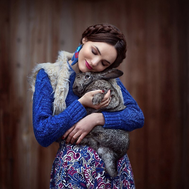 Woman Holding Rabbit — Blue, Serene